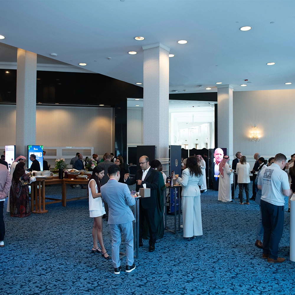 AI Summit attendees networking during the conference